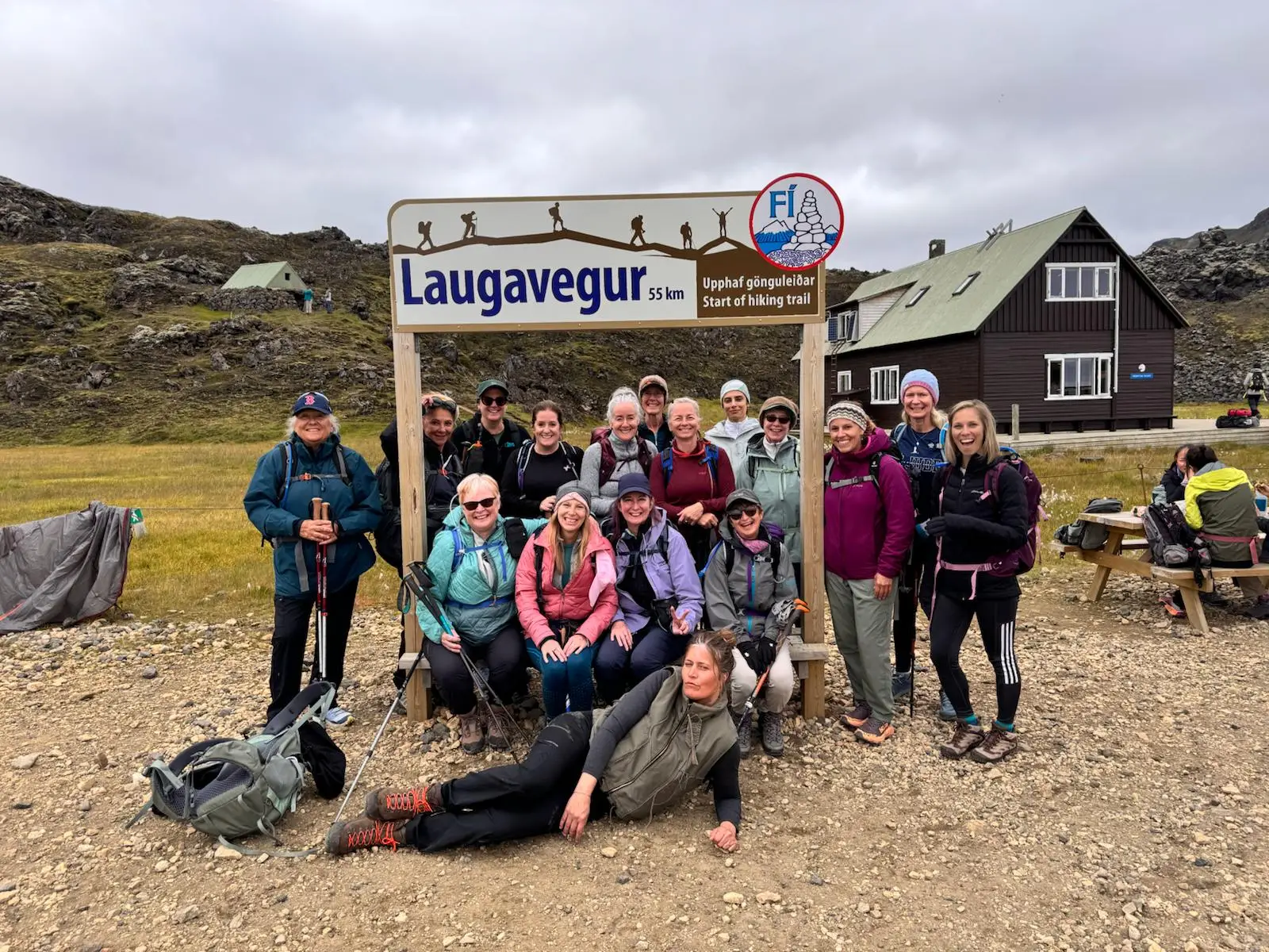 Group of hikers by the Laugavegur trail sign