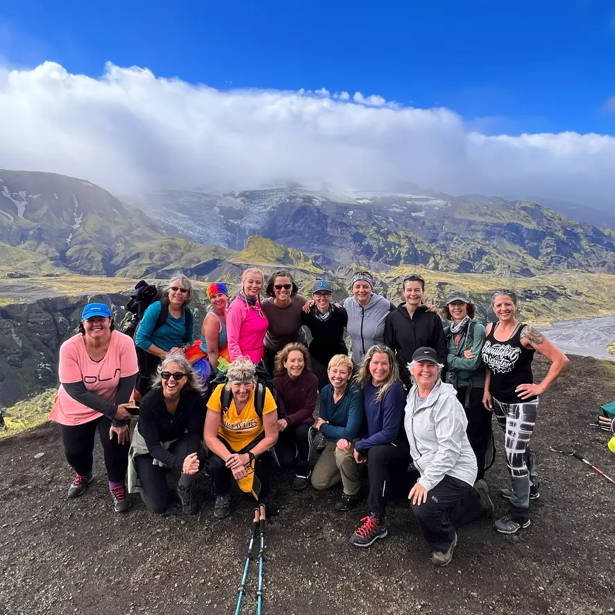 Group of women hikers posing on a mountain viewpoint