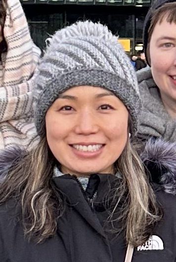 Smiling woman in a knitted hat in winter
