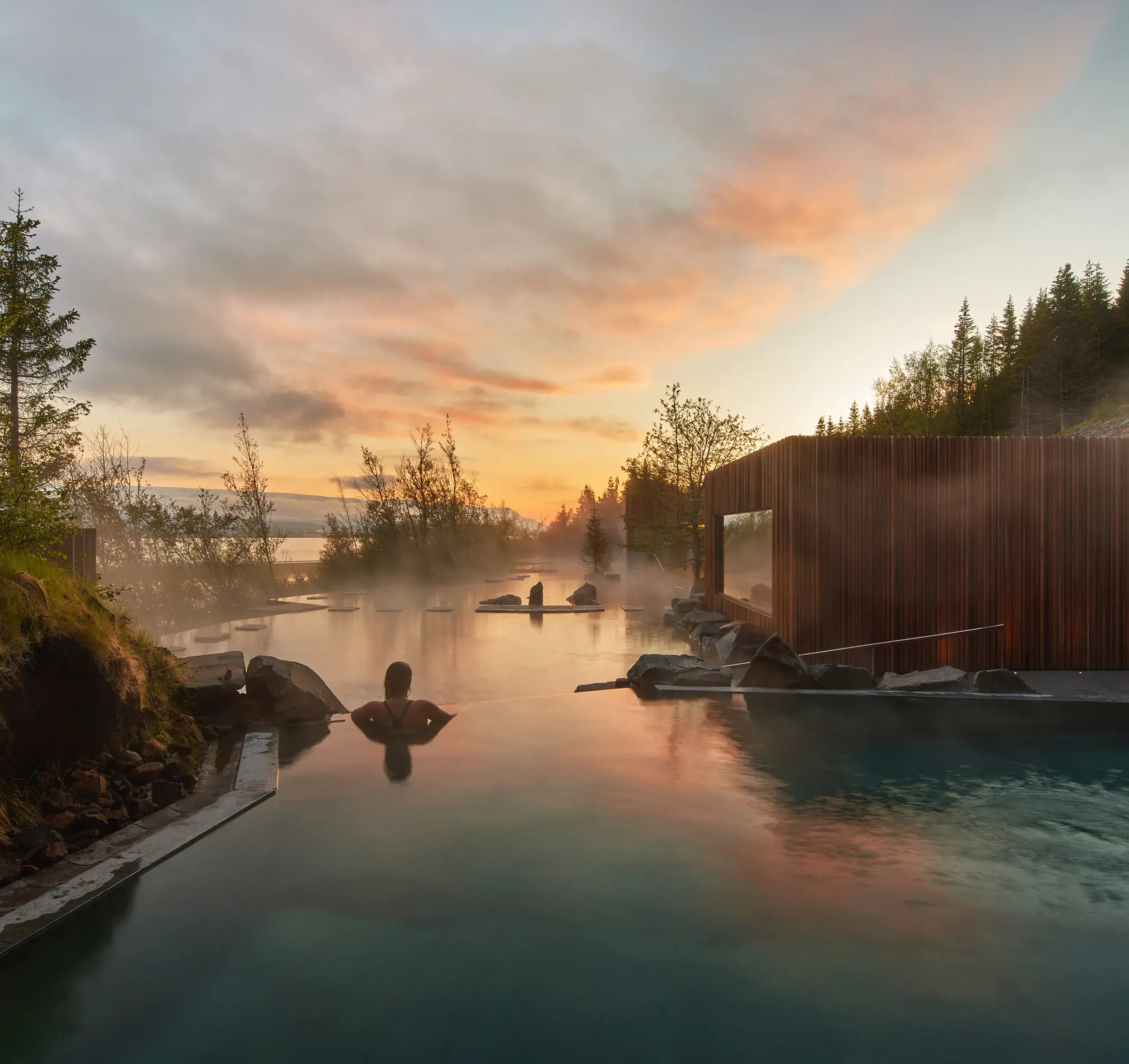 Steaming geothermal lagoon at sunrise