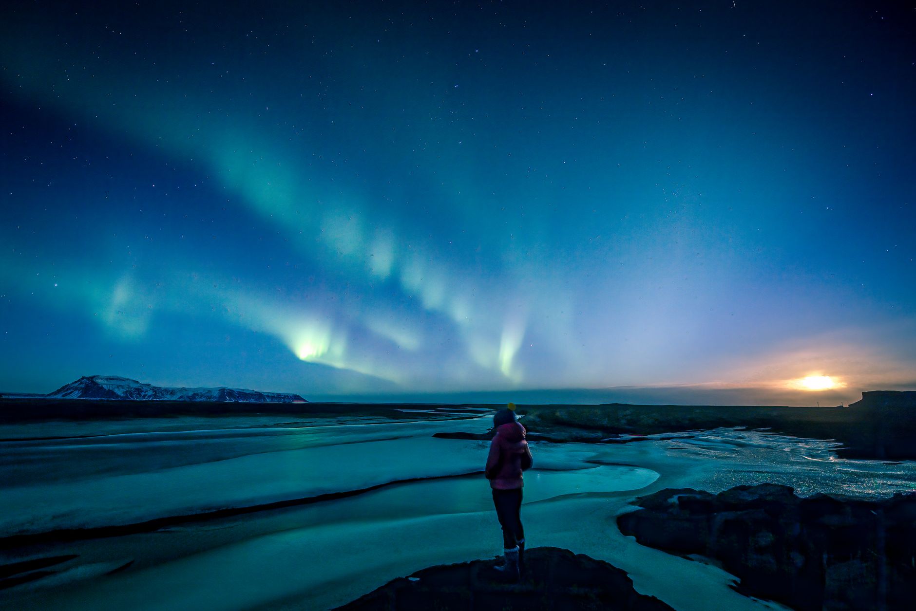 woman watching aurora borealis