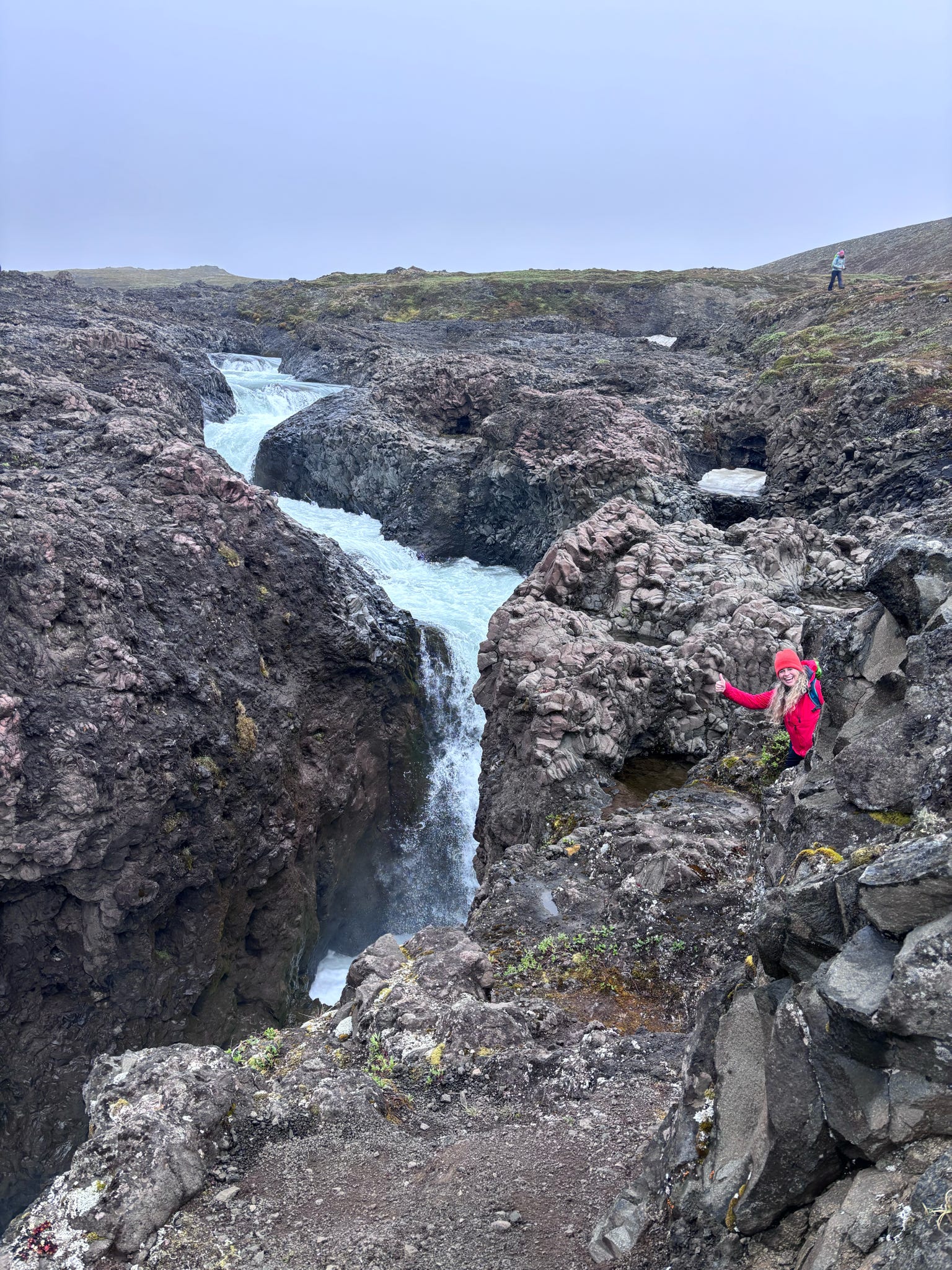 Waterfall flowing through a rocky gorge